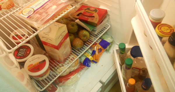 Beautiful, clean and organized fridge with wood and glass storage